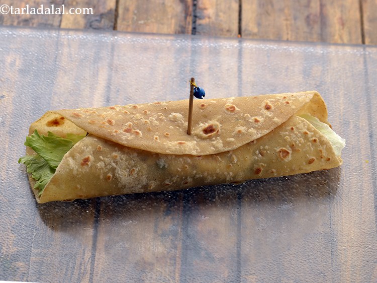 Step 44 – Repeat with the remaining ingredients to make 3 more corn and spinach katti rolls.