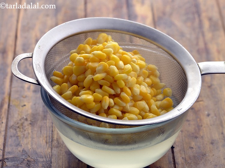 Step 19 – Drain the boiled corn kernels.