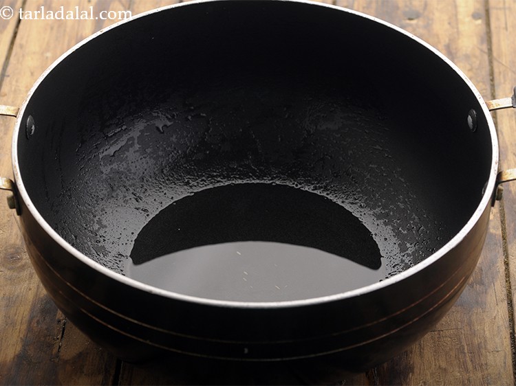 Step 5 – Now, heat oil in a deep non stick pan.&nbsp;