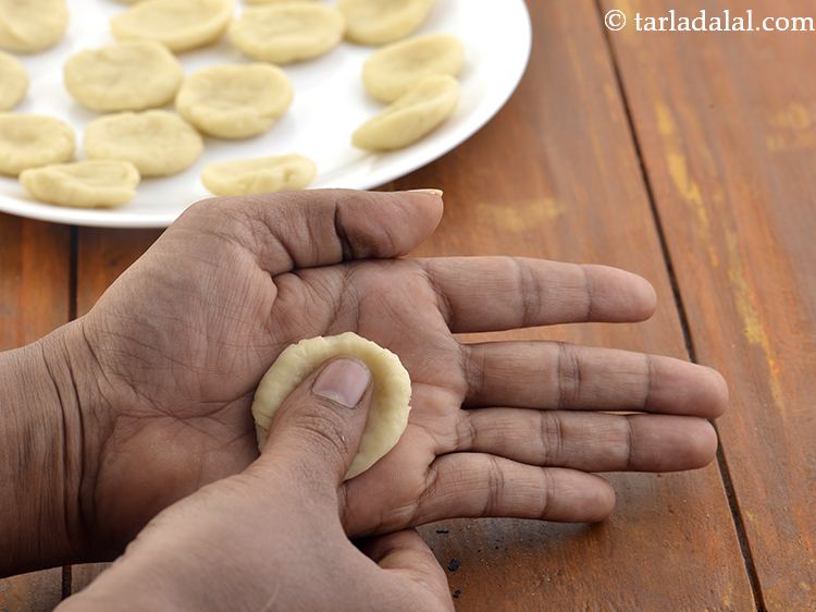 Step 13 – With help of your thumb press it in the centre to make a deep depression. …