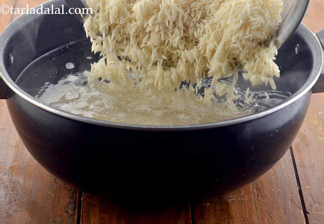 Step 7 – Add the rice to the boiling water and mix well.