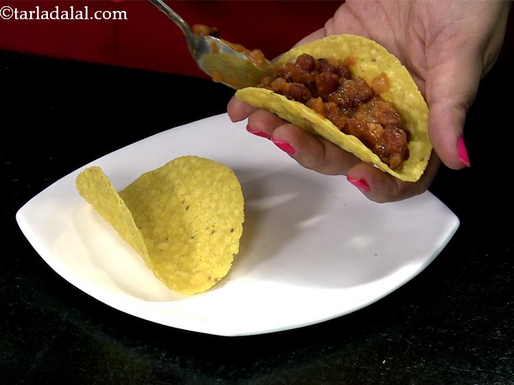 Step 21 – Take a taco shell and put about 1 tablespoon of rajma filling.