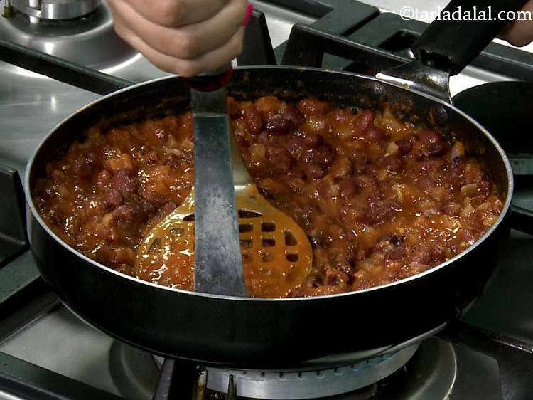 Step 11 – After adding the cooked rajma mix well.&nbsp;While the rajma mixture is being cooked, lightly mash …