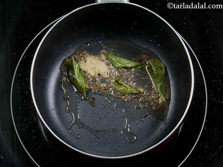 Step 23 – When the seeds crackle, add the curry leaves and asafoetida and saut? on a medium …