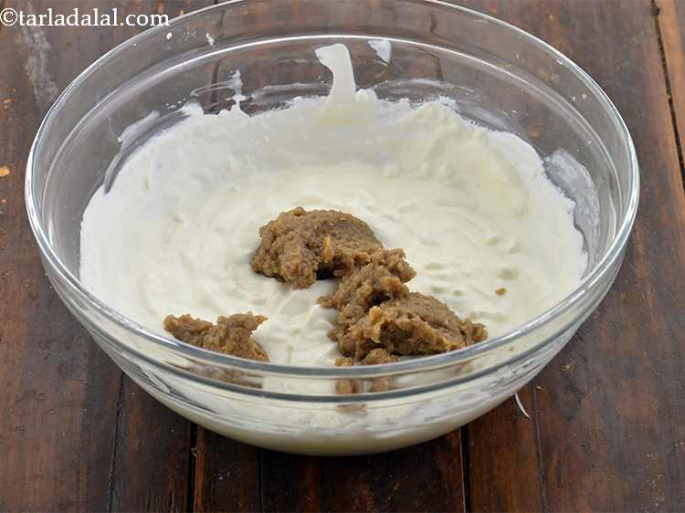Step 13 – Once blended, add the tahini paste to the whisked curd.