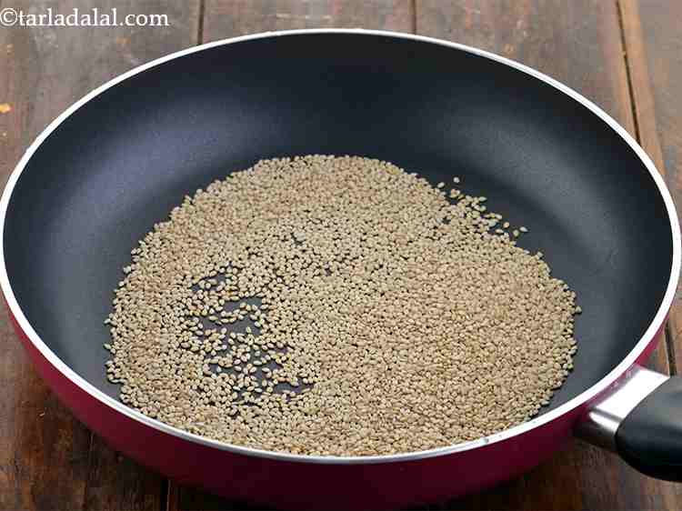 Step 5 – Heat a broad non-stick pan and place the sesame seeds in it.