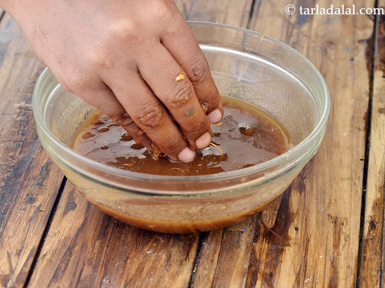 Step 18 – After 30 minutes, rub the tamarind well using your fingers till all the pulp has …