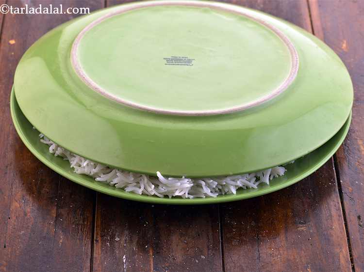 Step 11 – <p>Cover with another place so the top layer of rice does not dry out while …