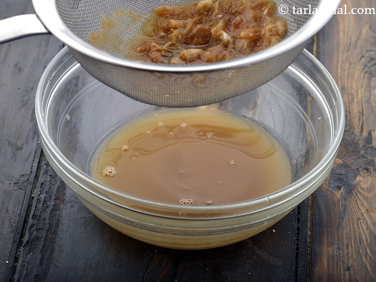 Step 6 – Discard the seeds and the remaining tamarind pulp in the strainer.