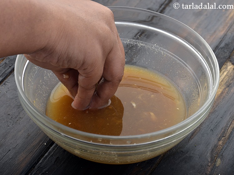 Step 26 – Now rub the tamarind well in the bowl containing water, using your fingers till all …