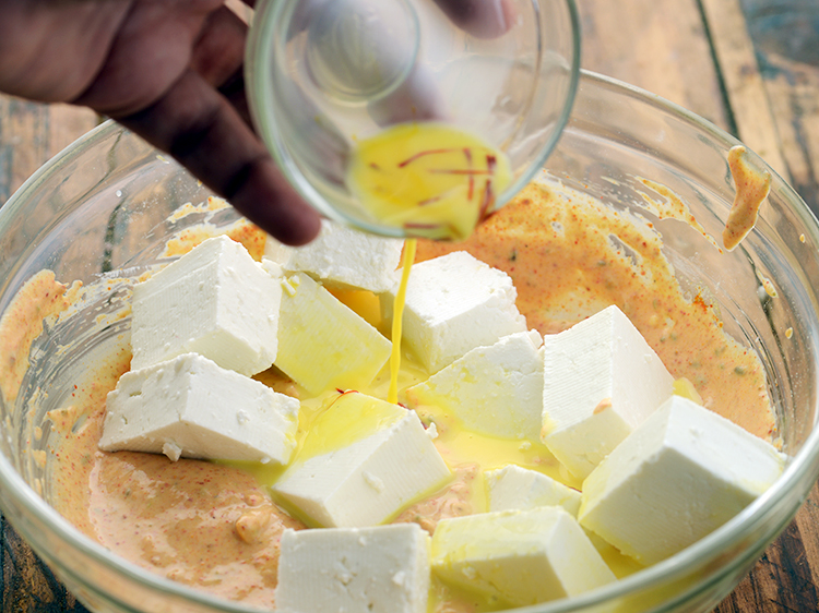 Step 18 – Drizzle the prepared milk-saffron mixture.