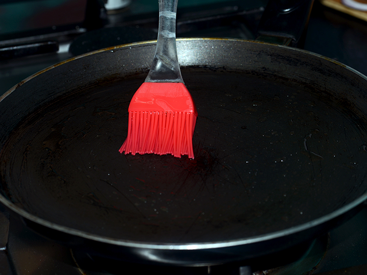 Step 20 – To cook the <strong>Tandoori paneer tikka</strong>, heat a non-stick tava (griddle), grease it lightly with …