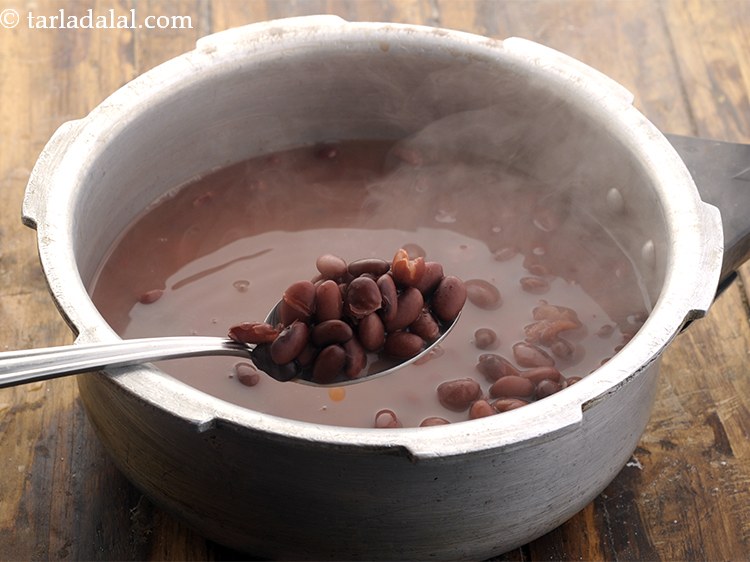 Step 18 – Allow the steam to escape before opening the lid. Press a rajma bean between your …