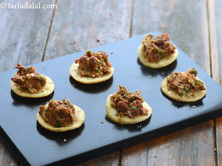 Step 28 – Top each papadi with &frac12; tbsp of the rajma topping.