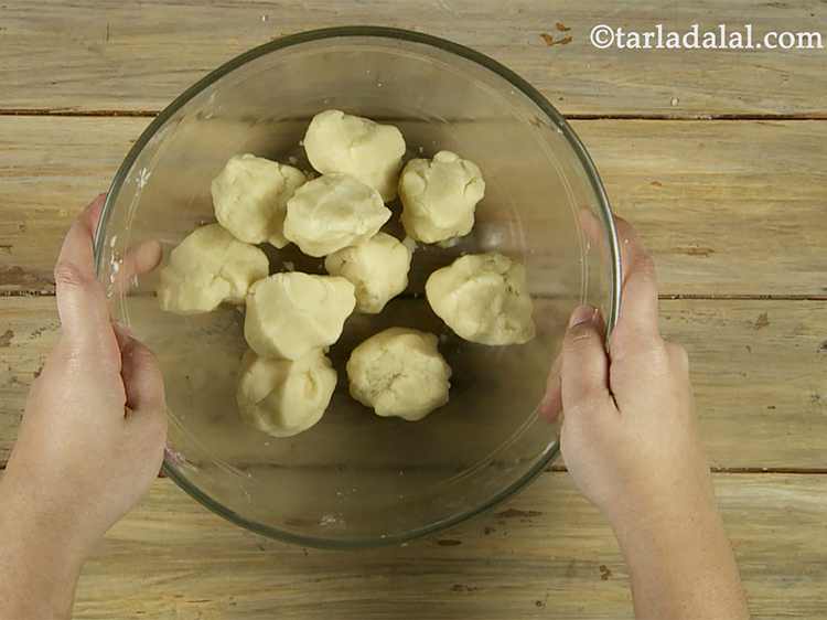 Step 5 – Knead the dough again, divide it into 10 equal portions. Do not over-knead. Kneading leads …