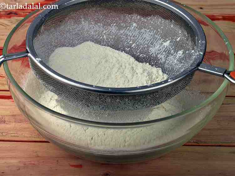 Step 1 – To make&nbsp;<strong>eggless tarts recipe | eggless tart shells | Indian style eggless tart |</strong>&nbsp;first sieve …