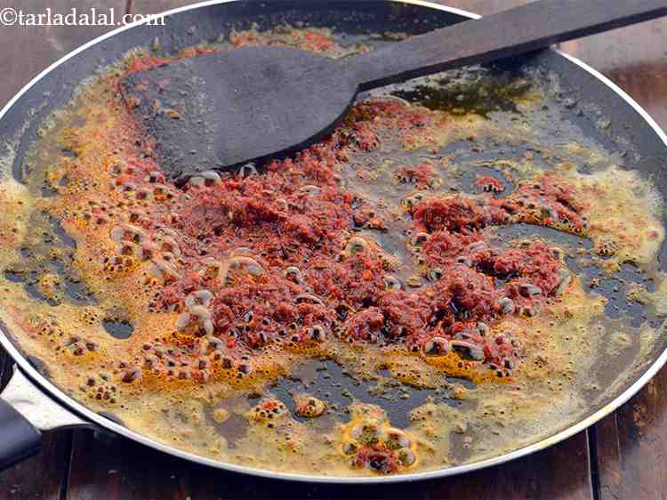 Step 19 – When the seeds crackle, add the chilli-garlic paste, mix well and saut&eacute; on a medium …