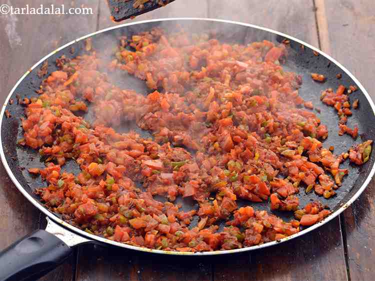 Step 22 – Add the tomatoes, mix well and again cook on a medium flame for 3 to …
