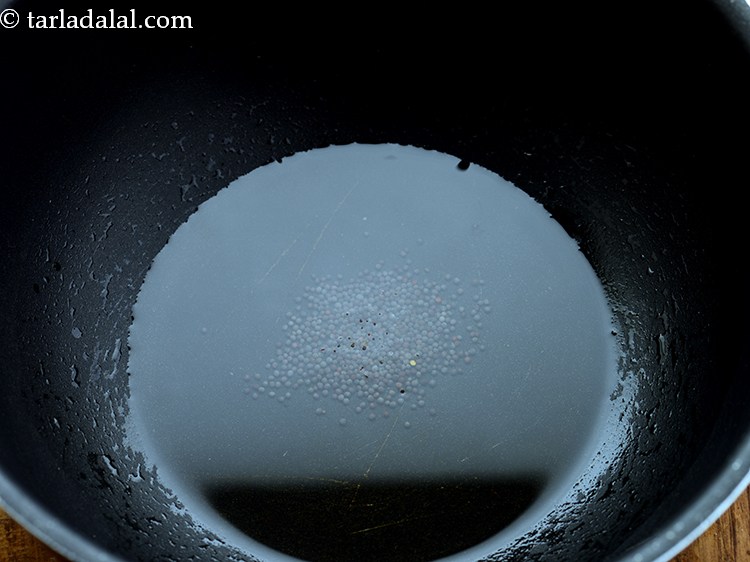 Step 14 – Once the ghee is hot, add the mustard seeds.