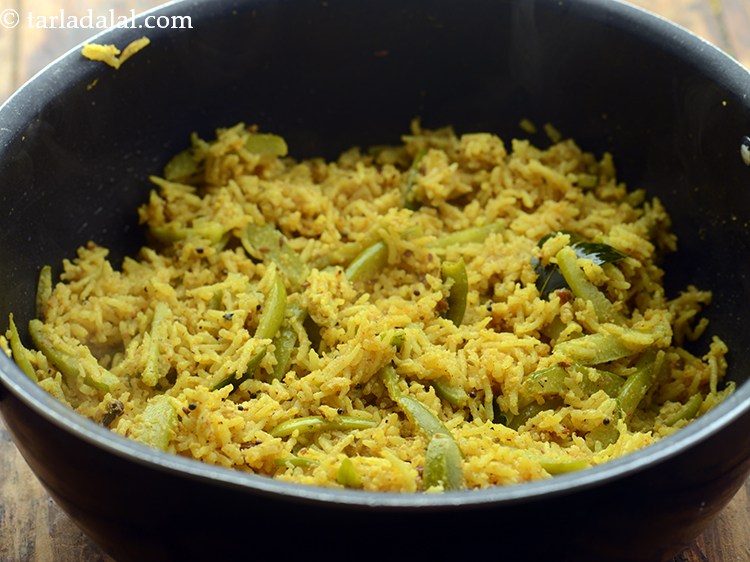 Step 33 – Mix well and cook on a medium flame for 1 minute, while stirring occasionally.&nbsp;<strong>tendli bhaat …