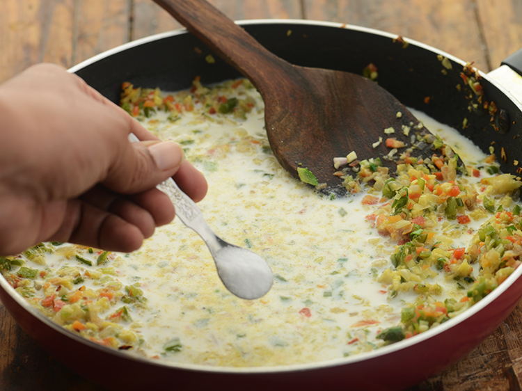 Step 13 – Add coconut milk powder-cornflour mixture and salt.