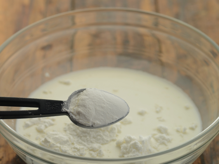 Step 4 – Add cornflour. It will help in thickening the coconut sauce.