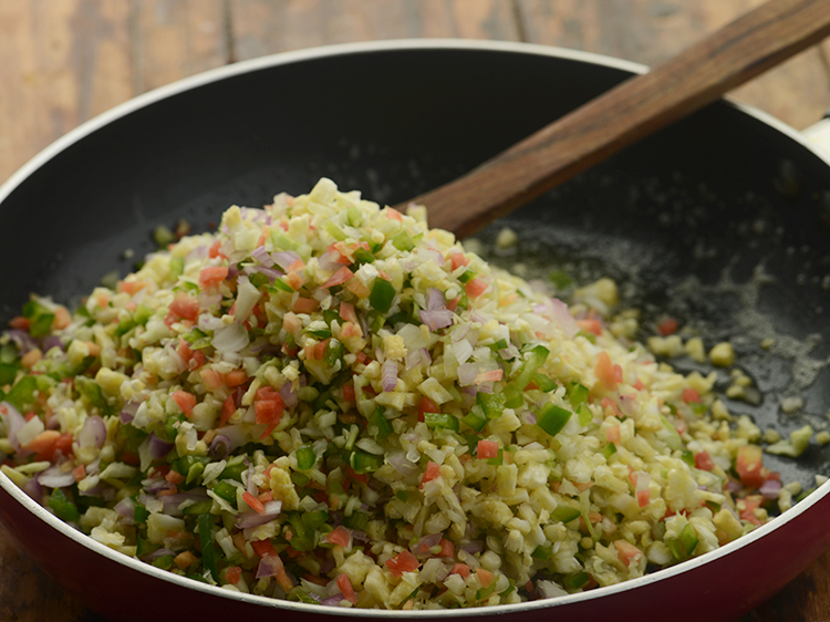 Step 7 – When the butter melts, add the mixed vegetables. We have used onions, cabbage, carrot, capsicum …