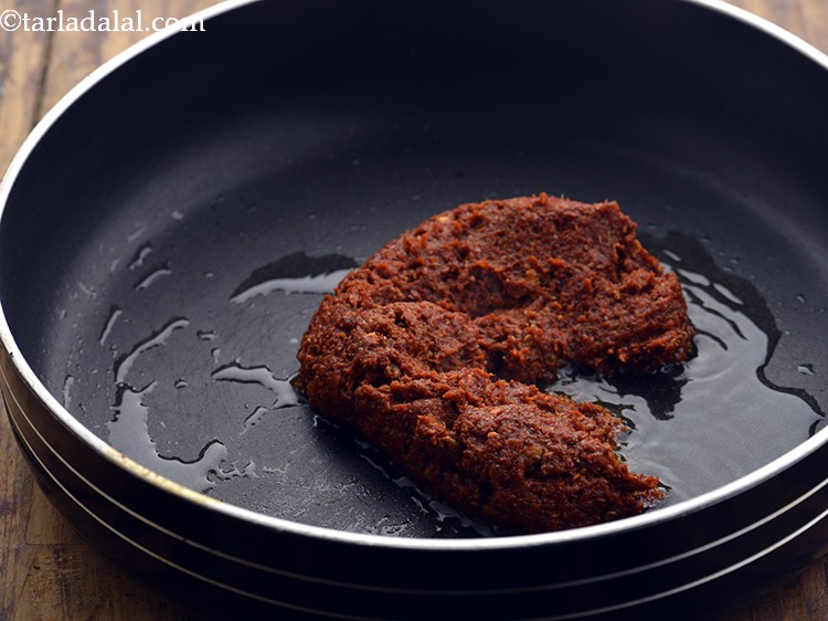 Step 13 – Once the oil is moderately hot, add 5 to 6 tbsp of the red curry …