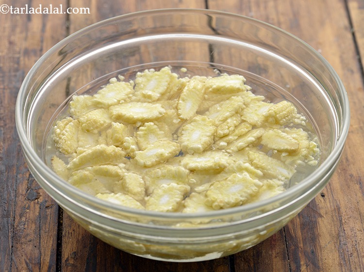 Step 8 – Transfer the baby corns in a bowl of water. Place it in the microwave and …