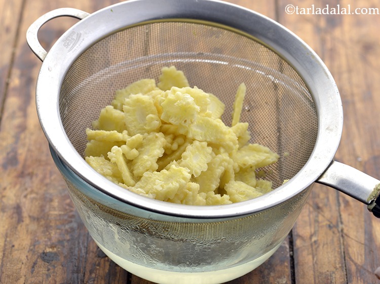 Step 9 – Remove and drain the baby corns. Keep aside.