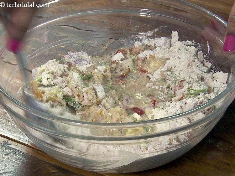 Step 14 – Gradually, add water to form a thick batter. This being a quick recipe we are …