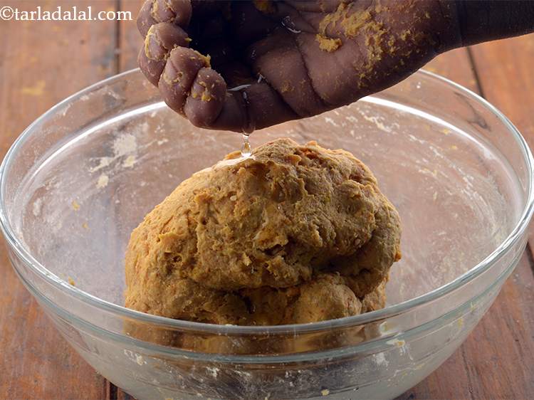 Step 11 – Add a few more drops of oil and knead well to smoothen the dough