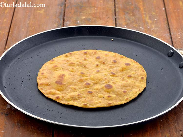 Step 19 – Apply a little oil and cook for a few more seconds till the&nbsp;<strong>Theplas</strong>&nbsp;turn golden brown …