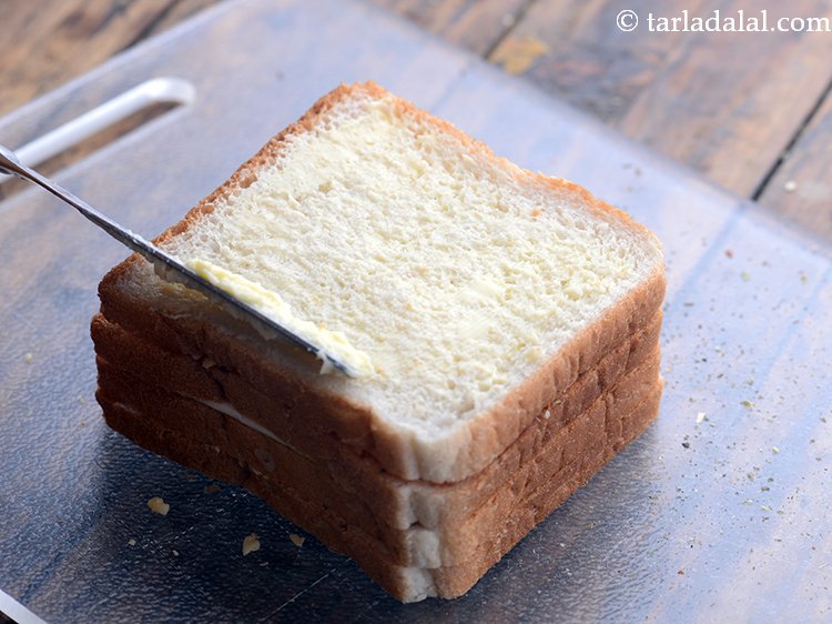 Step 12 – Apply a little butter on top of the bread.
