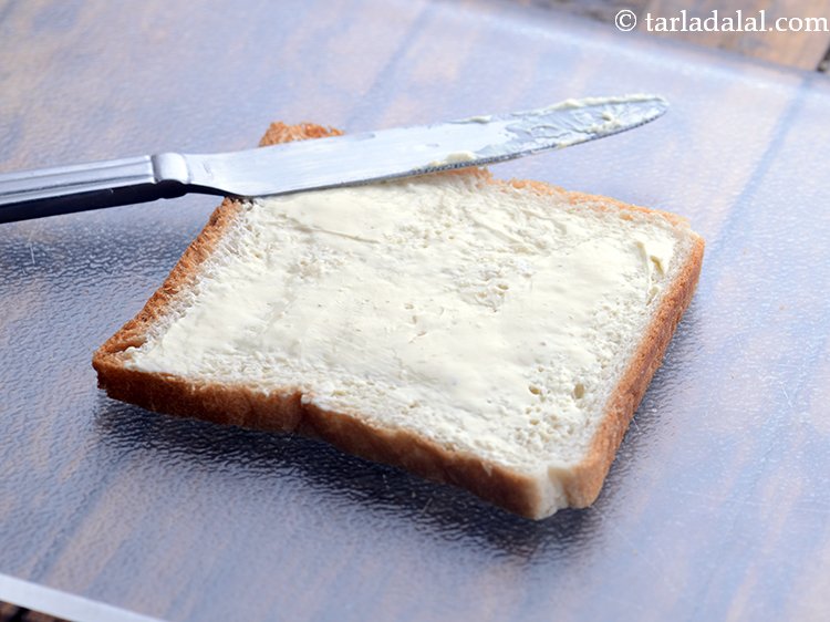 Step 3 – Spread 2 tsp of cheese spread over the bread.&nbsp;