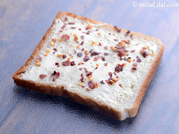 Step 4 – Sprinkle &frac14; tsp of chilli flakes evenly over it. You can adjust the quantity of …