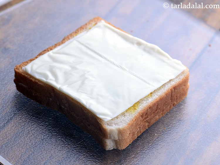 Step 7 – Place a cheese slice over it.