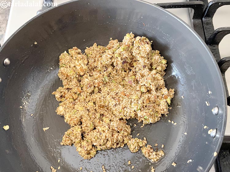 Step 14 – Be very quick and mix well so all the jaggery has coated the seeds properly.