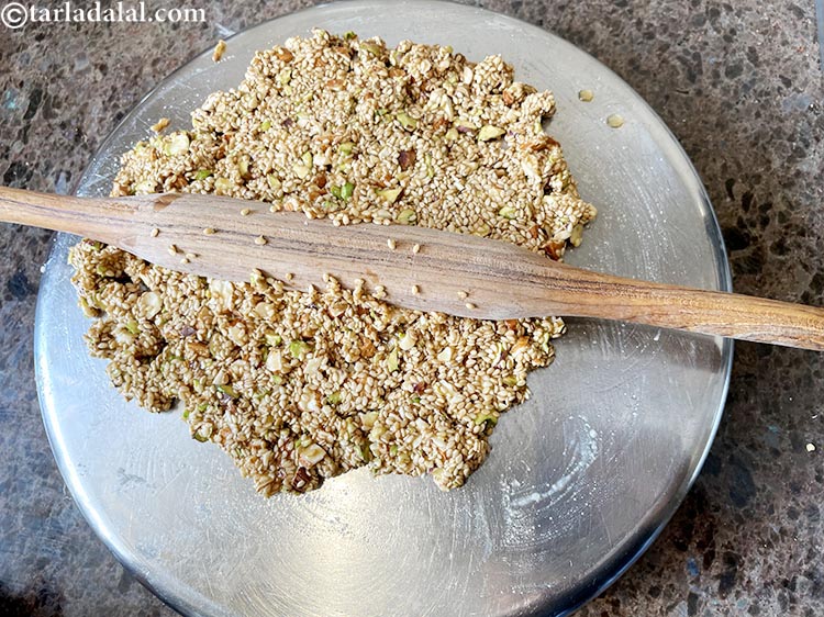 Step 15 – Switch off the flame.&nbsp;Immediately transfer the entire mixture on the back side of the greased …