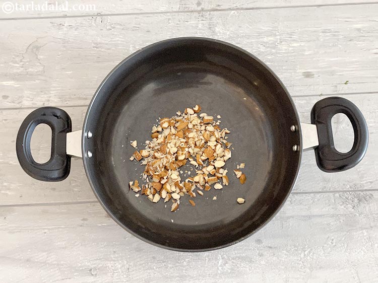 Step 6 – In the same deep non-stick pan, add the almonds.