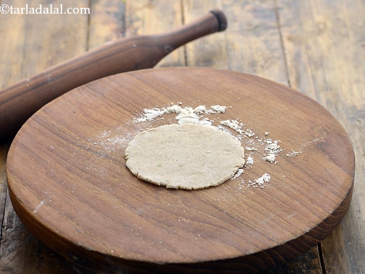 Step 11 – For preparing the jowar and til puri, roll out each portion into a thin 50 …