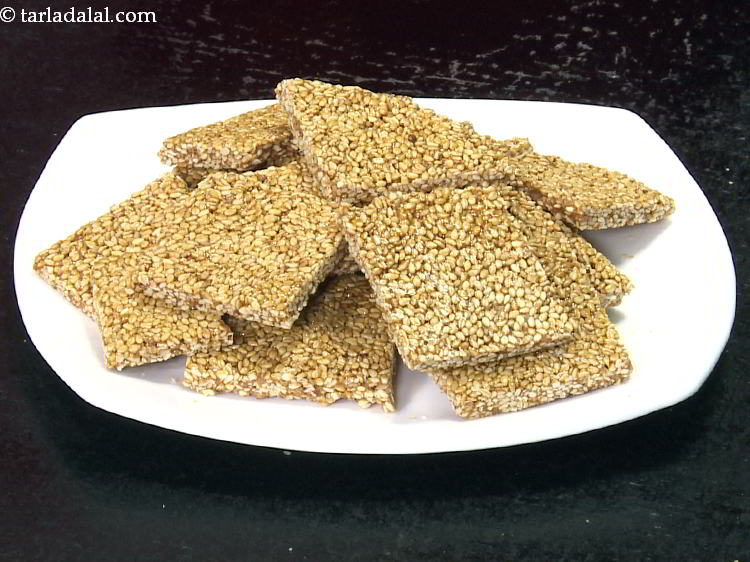 Step 20 – Finally scrape with a flat ladle to get<strong>&nbsp;til chikki for kids recipe | til chikki …