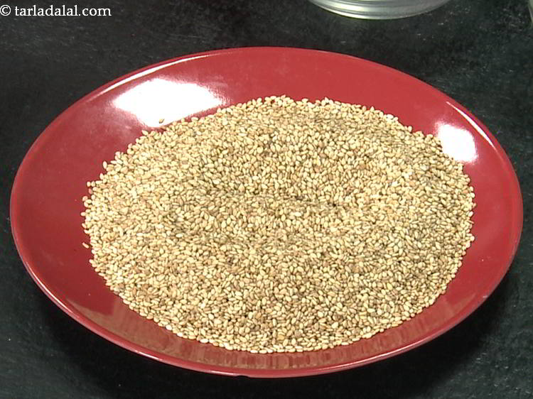 Step 6 – Switch off the flame and transfer the roasted sesame seeds onto a flat plate for …
