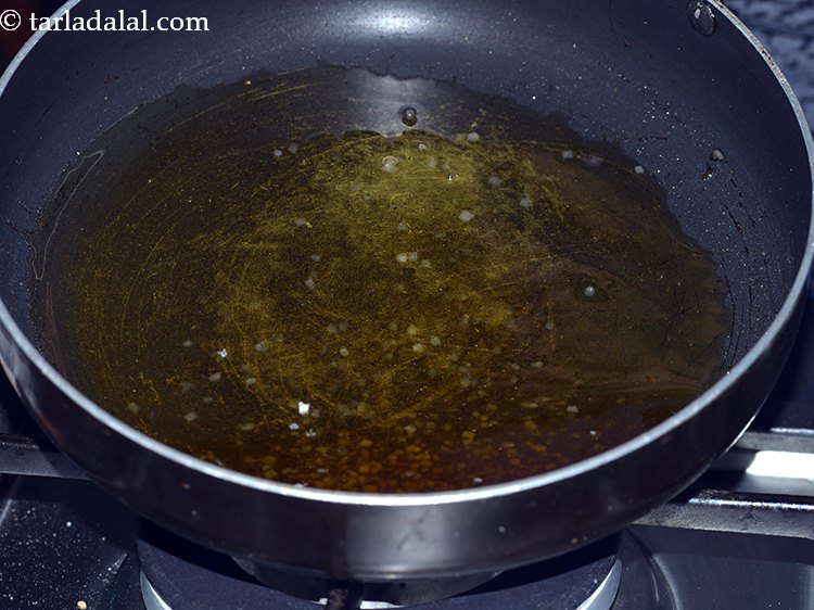 Step 7 – Keep stirring it continuously. Once it starts melting, tilt the pan till the sugar melts …
