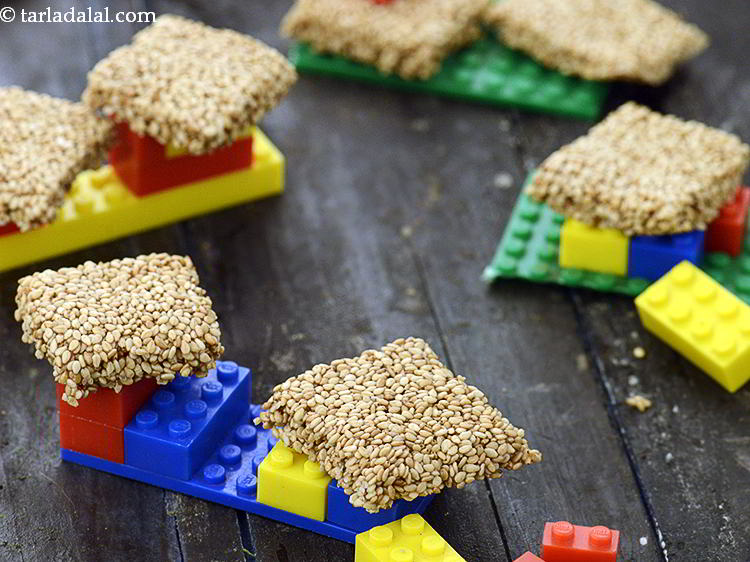 Step 21 – If you like&nbsp;<strong>til chikki for kids,</strong>&nbsp;also try other recipes for Makarsankranti like&nbsp;<strong><a href="https://www.tarladalal.com/Mixed-Til-Chikki-4197r" target="_blank">Mixed Til …