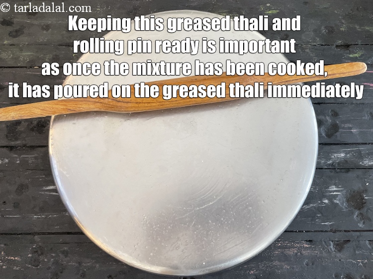 Step 23 – <strong>Keeping this greased thali and rolling pin ready is important as once the mixture has …