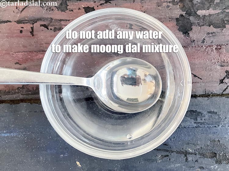 Step 30 – Do not add any water to make moong dal mixture.