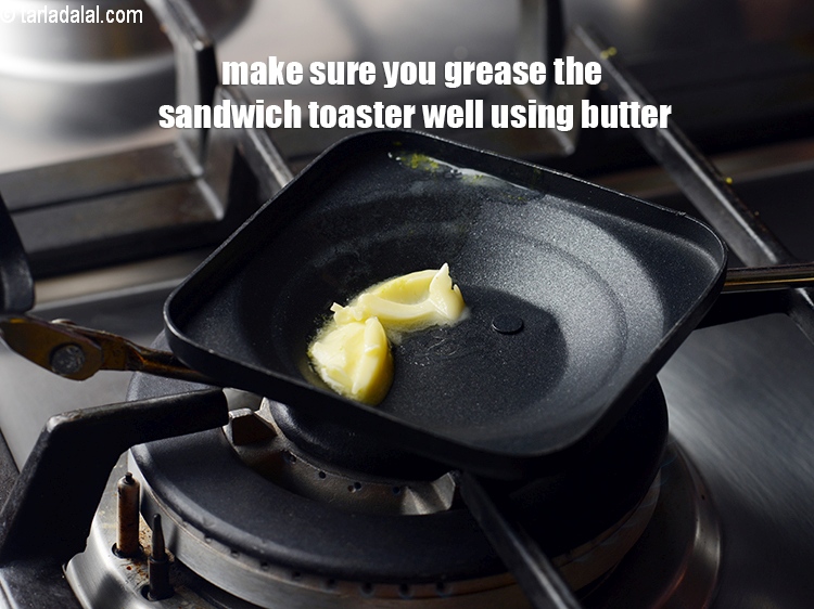 Step 26 – Make sure you grease the sandwich toaster well using butter.