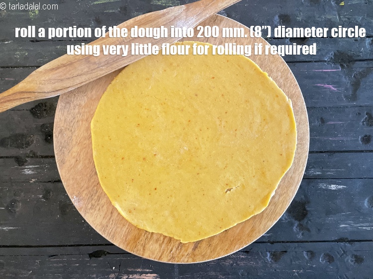 Step 57 – <meta charset="UTF-8" />Roll a portion of the dough into 200 mm. (8&rdquo;) diameter circle<u><em>&nbsp;using very …