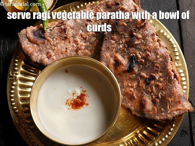 Step 28 – Serve <strong>ragi vegetable paratha&nbsp;</strong>with a bowl of curds.